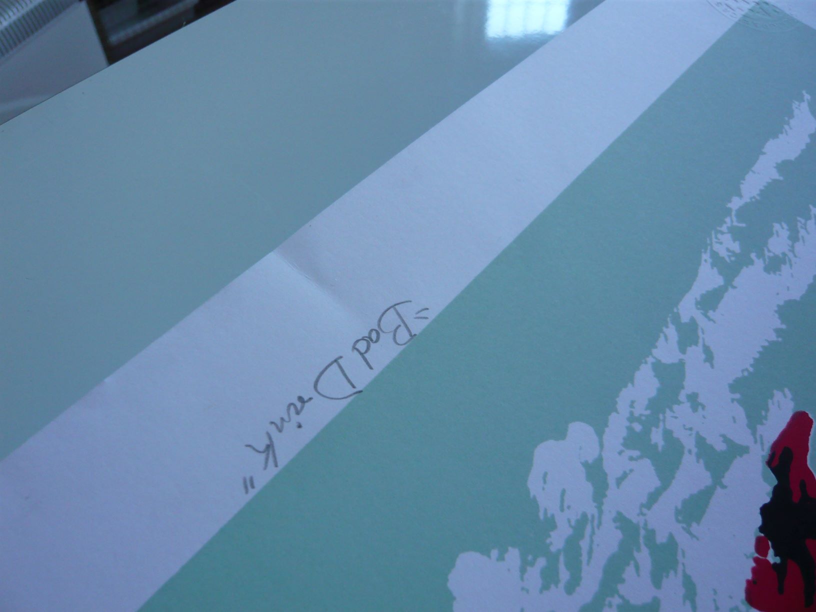 Crease near the title of a print before treatment