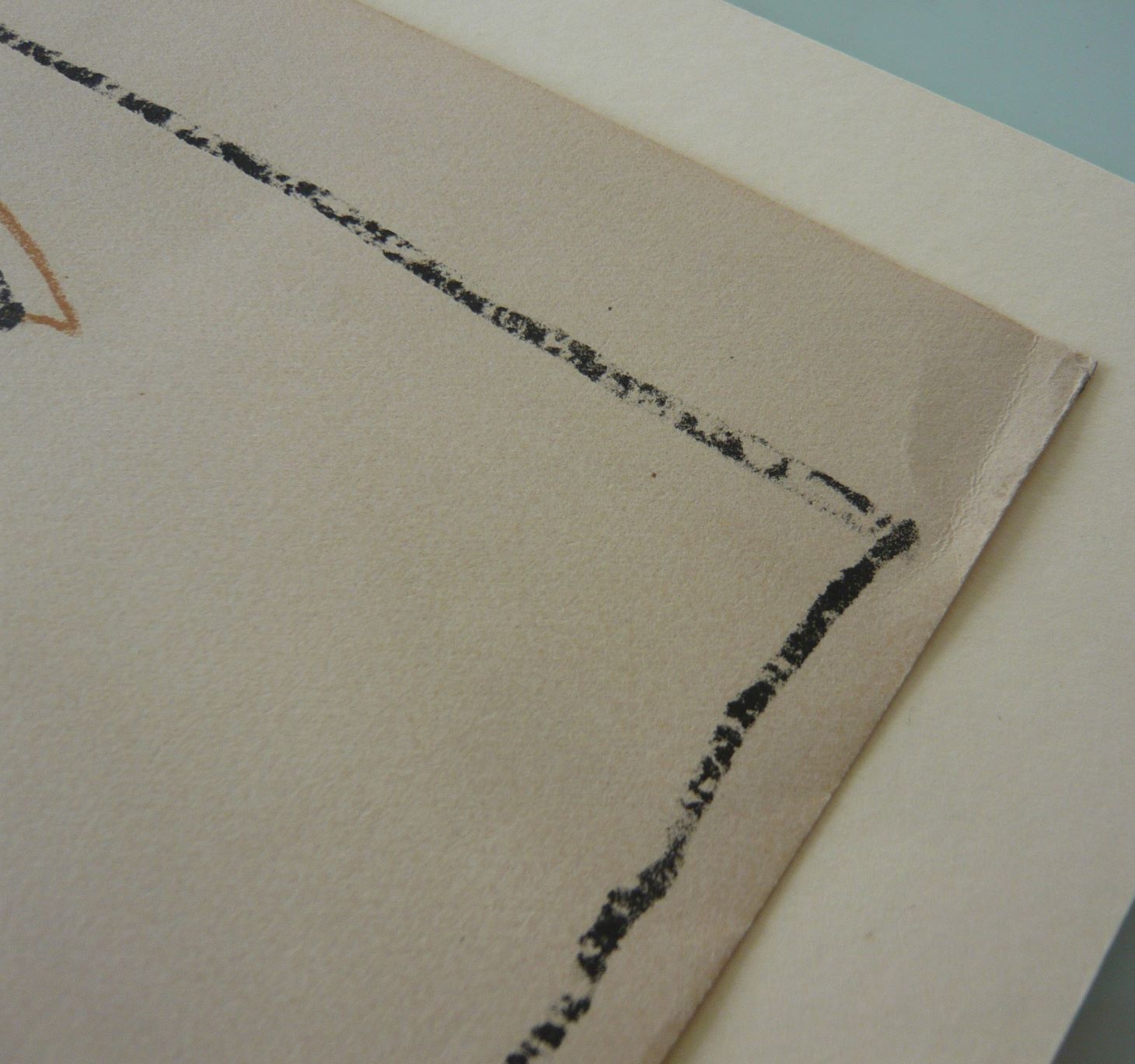 Crease at the corner of a print before treatment